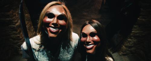 Universal Pictures Psychotic celebrants prepare to attack the Sandin family in “The Purge”, a speculative thriller that follows one family over the course of a single night to see how far they will go to protect themselves when the vicious outside world breaks into their home.